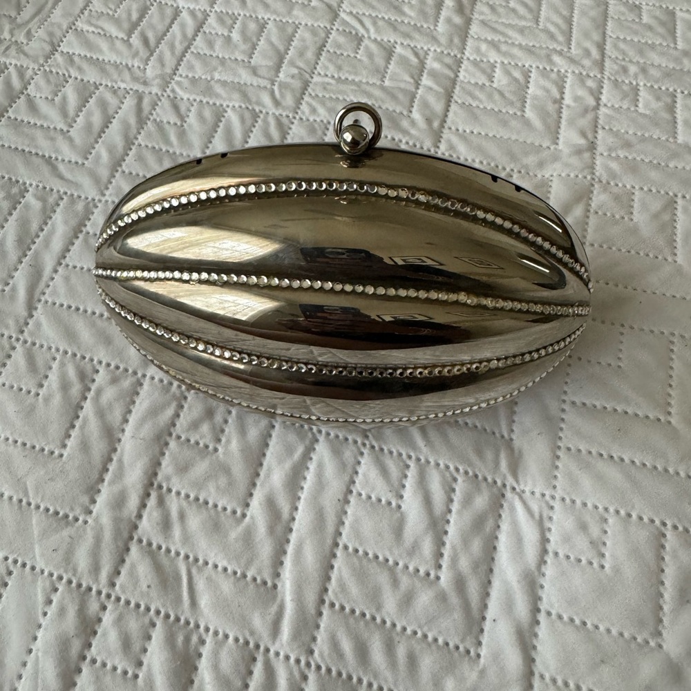 Silver studded hard shell clutch